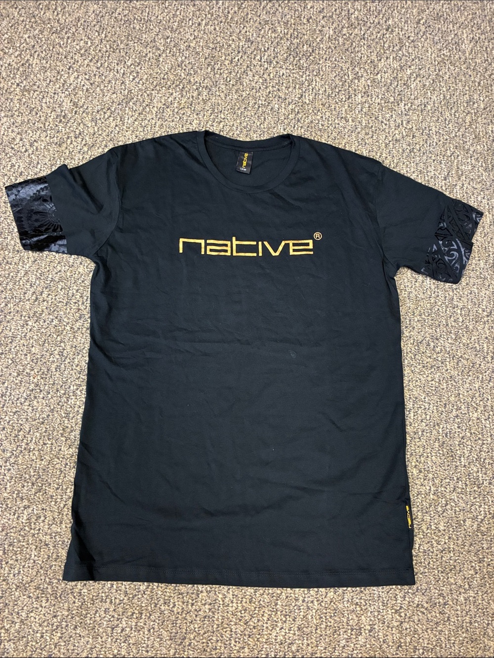 NWOT Native Black Tee with Gold Logo and Patterned Sleeve Trim